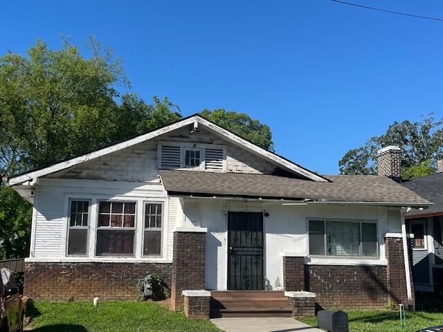 bungalow with a front lawn