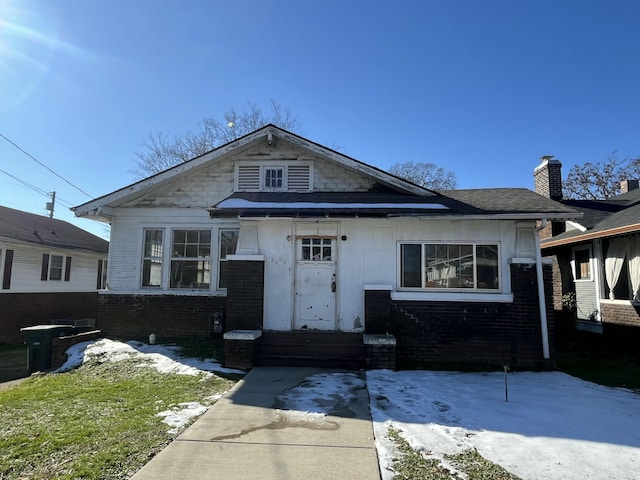 bungalow-style house featuring a patio