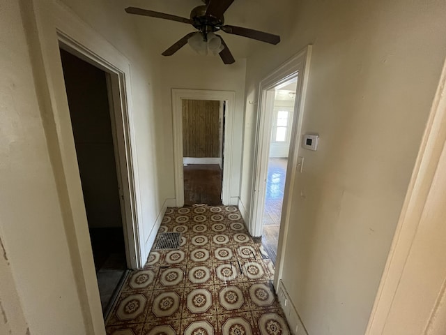 corridor with light tile patterned floors