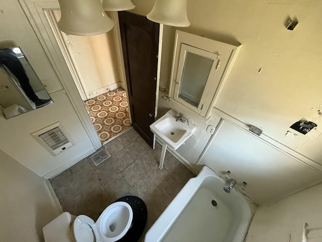 bathroom with toilet and sink