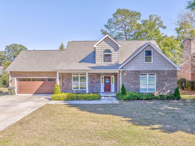 view of front of home featuring a front yard and a garage