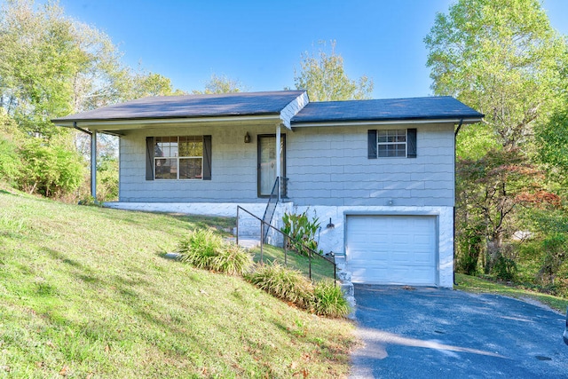 ranch-style house with a front lawn and a garage