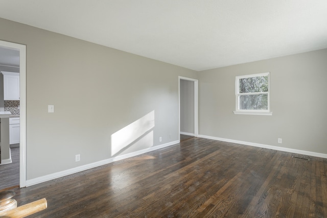 empty room featuring dark hardwood / wood-style floors