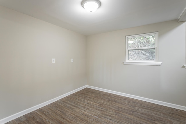 empty room featuring dark wood-type flooring