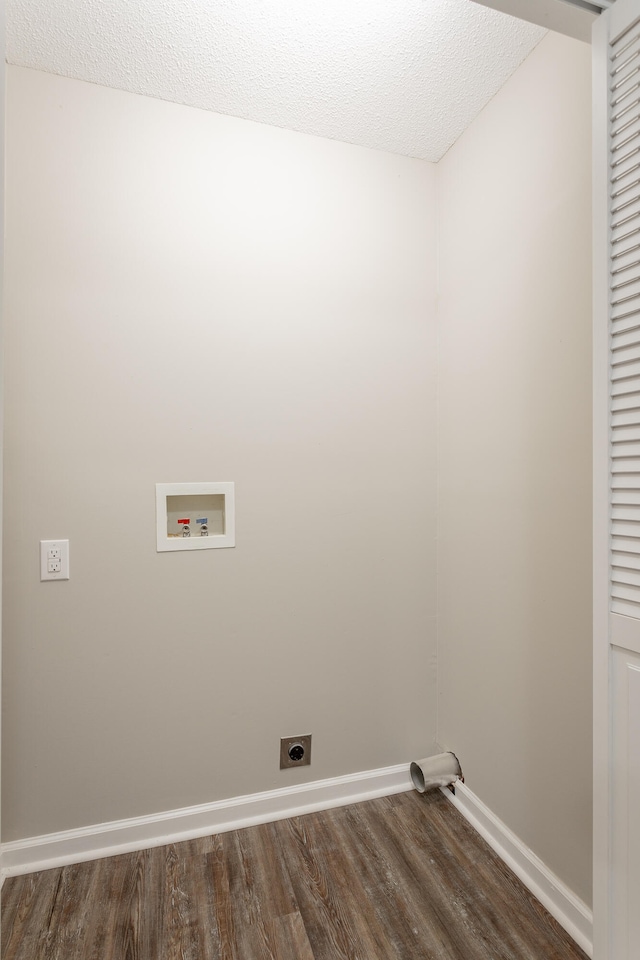 laundry room with hookup for an electric dryer, hookup for a washing machine, a textured ceiling, and dark hardwood / wood-style flooring