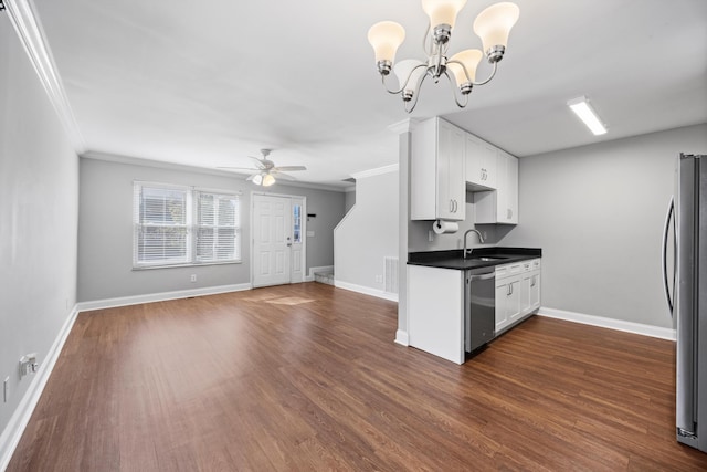 kitchen featuring appliances with stainless steel finishes, dark hardwood / wood-style floors, white cabinets, and ornamental molding