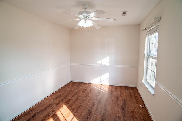 unfurnished room featuring dark hardwood / wood-style floors and ceiling fan