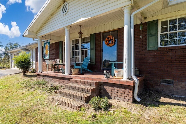 property entrance featuring a porch