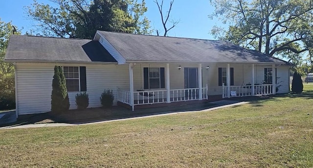 ranch-style home with covered porch and a front lawn