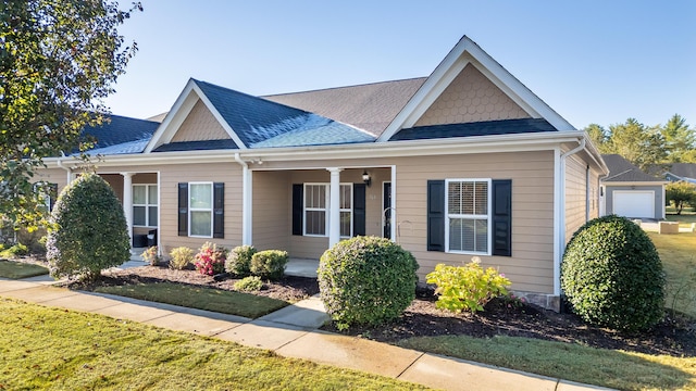 view of front facade with a front yard and a garage