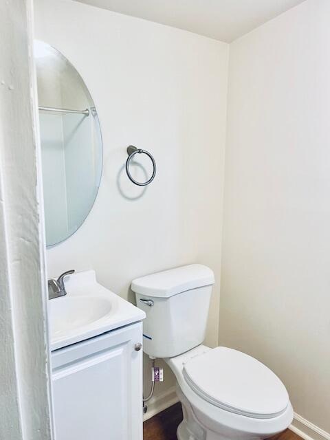 bathroom with toilet and vanity