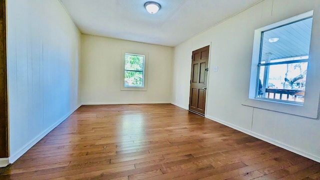 empty room with dark hardwood / wood-style floors