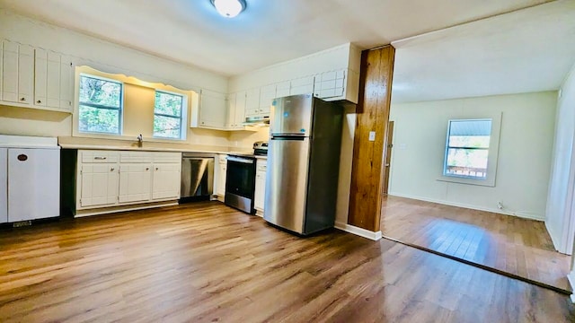 kitchen with white cabinetry, stainless steel appliances, light hardwood / wood-style floors, and plenty of natural light