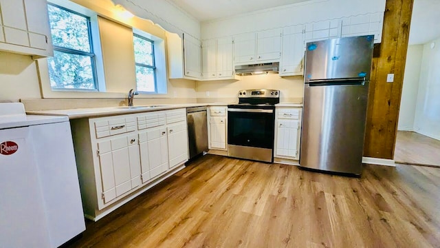 kitchen featuring sink, white cabinets, stainless steel appliances, and light wood-type flooring