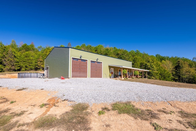 view of outbuilding with a garage