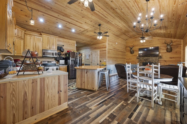 kitchen with lofted ceiling, wooden ceiling, wood walls, dark wood-type flooring, and stainless steel appliances