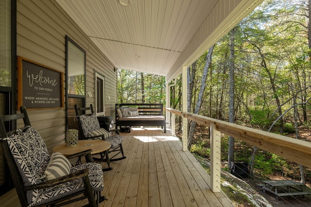 wooden deck featuring covered porch