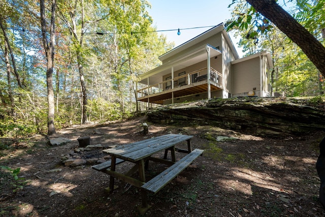 back of house with a balcony