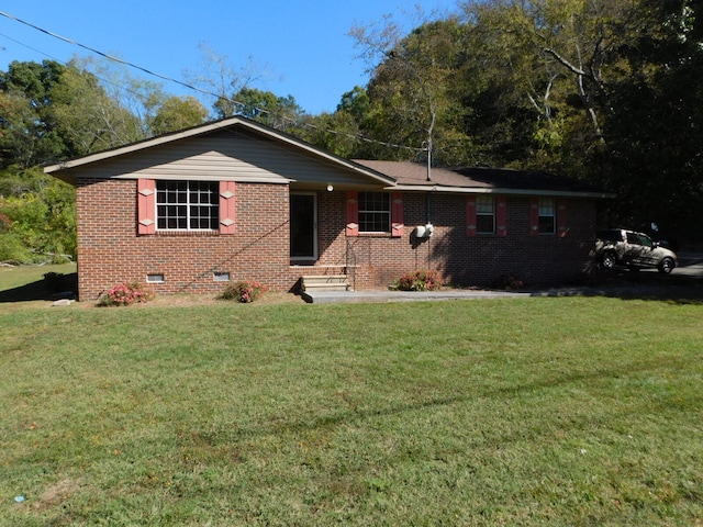 ranch-style house with a front lawn