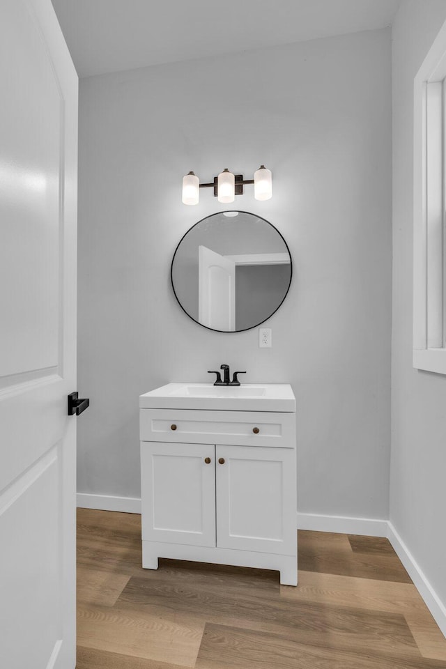 bathroom with wood-type flooring and vanity