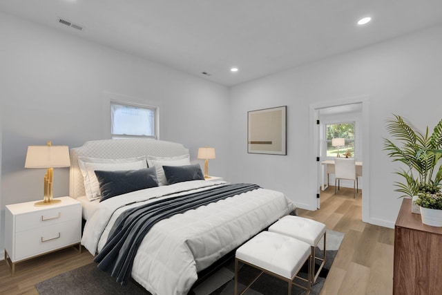 bedroom with light wood-type flooring