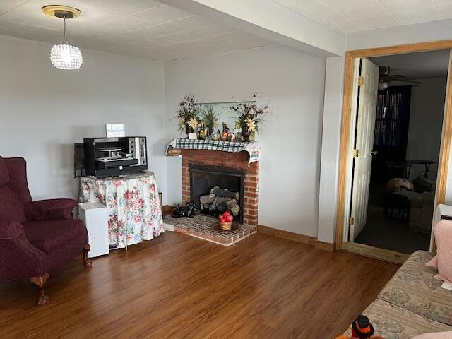 living room featuring a fireplace and dark hardwood / wood-style floors