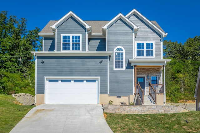 view of front of home featuring stairway, an attached garage, and driveway