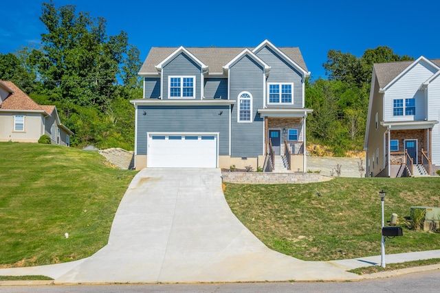 view of front facade with a garage, driveway, and a front lawn
