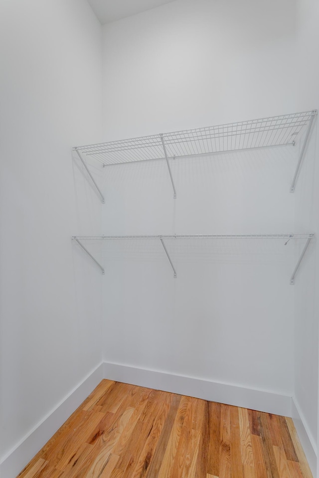 spacious closet with light wood-style floors