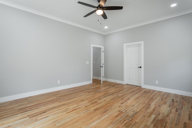 empty room featuring ornamental molding, baseboards, light wood-type flooring, recessed lighting, and a ceiling fan