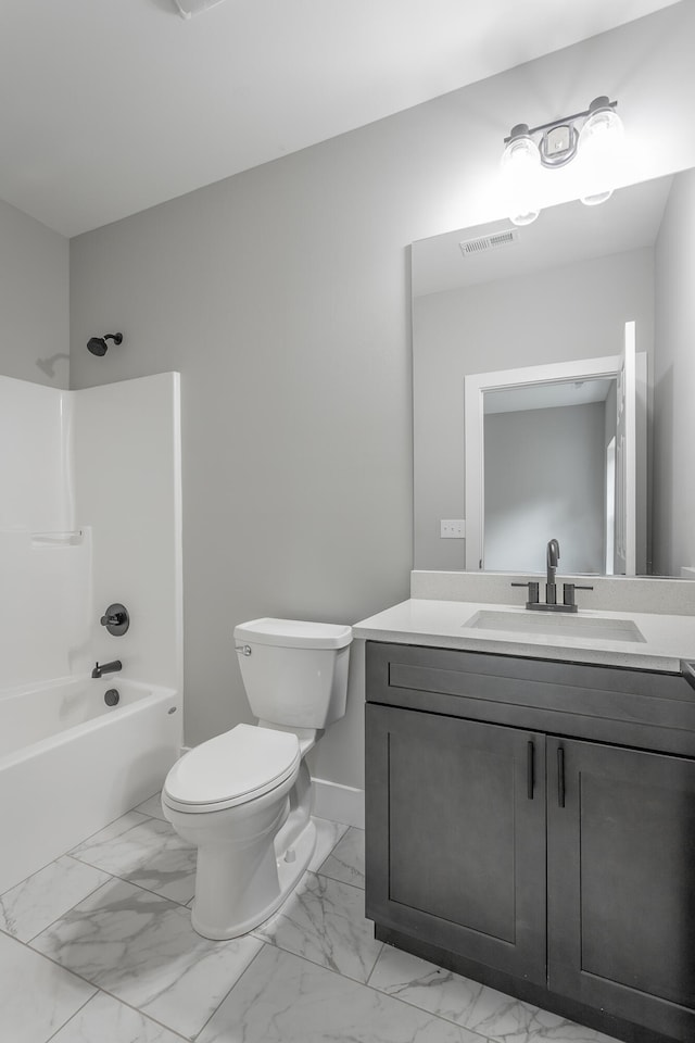 full bathroom featuring vanity, bathtub / shower combination, and toilet