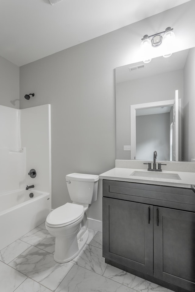 full bathroom featuring visible vents, vanity, marble finish floor, bathing tub / shower combination, and toilet