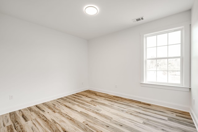 unfurnished room featuring light hardwood / wood-style flooring