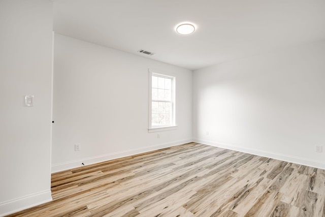 spare room with light wood-type flooring