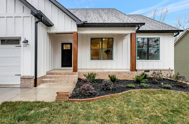 entrance to property featuring crawl space, a shingled roof, board and batten siding, and an attached garage