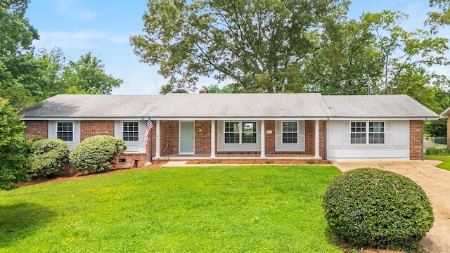 4011 Patton Edwards Dr, Chattanooga, TN 37412 - ranch-style home with brick siding, a front yard, and concrete driveway