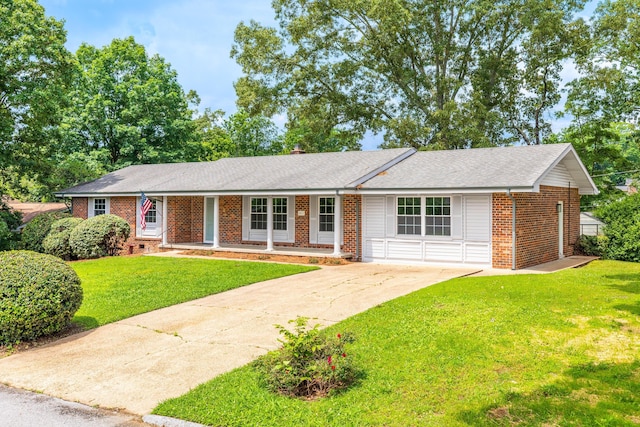 4011 Patton Edwards Dr, Chattanooga, TN 37412 - single story home featuring brick siding, concrete driveway, a front yard, and a shingled roof