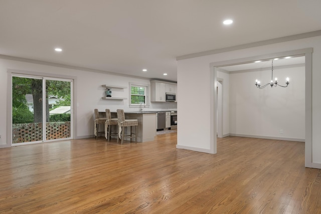 4011 Patton Edwards Dr, Chattanooga, TN 37412 - living room featuring a chandelier, recessed lighting, and light wood-style floors