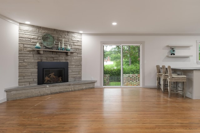 4011 Patton Edwards Dr, Chattanooga, TN 37412 - living room with wood finished floors, a stone fireplace, and recessed lighting