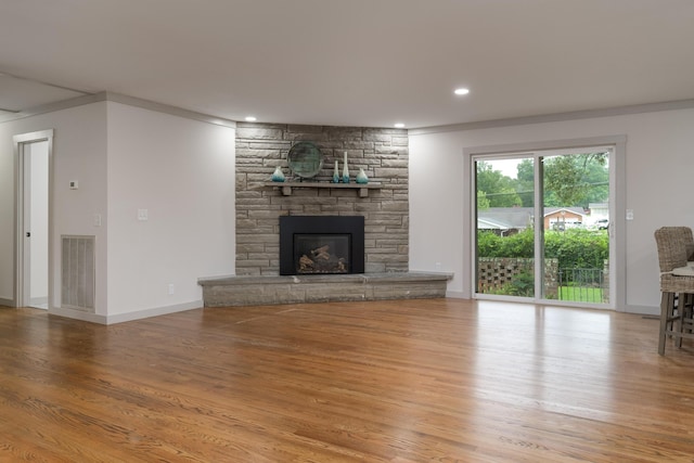 4011 Patton Edwards Dr, Chattanooga, TN 37412 - unfurnished living room with wood finished floors, a fireplace, ornamental molding, and recessed lighting