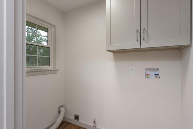 4011 Patton Edwards Dr, Chattanooga, TN 37412 - washroom featuring hookup for an electric dryer, hookup for a washing machine, cabinet space, and wood finished floors