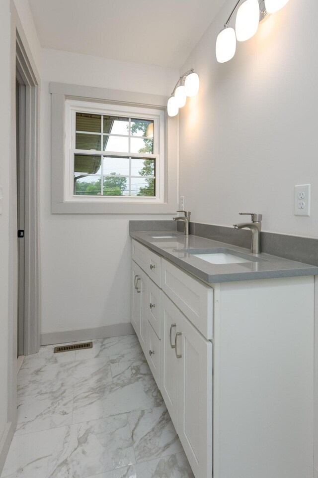 4011 Patton Edwards Dr, Chattanooga, TN 37412 - bathroom featuring marble look tile flooring and double vanity