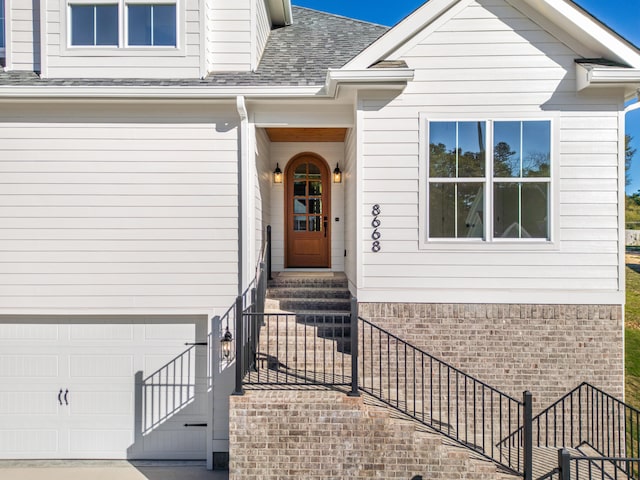 view of exterior entry featuring a garage