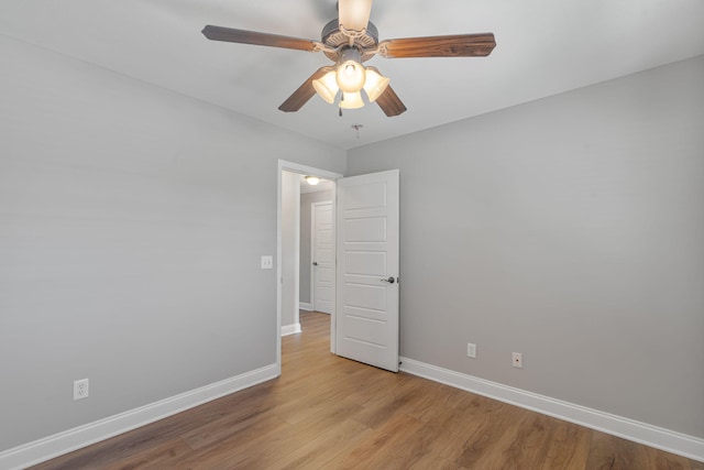 unfurnished room with ceiling fan and light hardwood / wood-style flooring