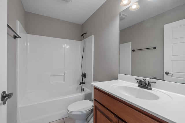 full bathroom with shower / bathing tub combination, toilet, vanity, and tile patterned floors