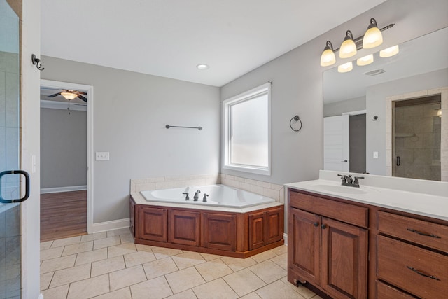 bathroom with vanity, ceiling fan, tile patterned floors, and plus walk in shower