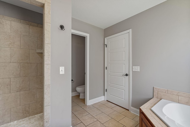 bathroom featuring toilet, tile patterned floors, and separate shower and tub