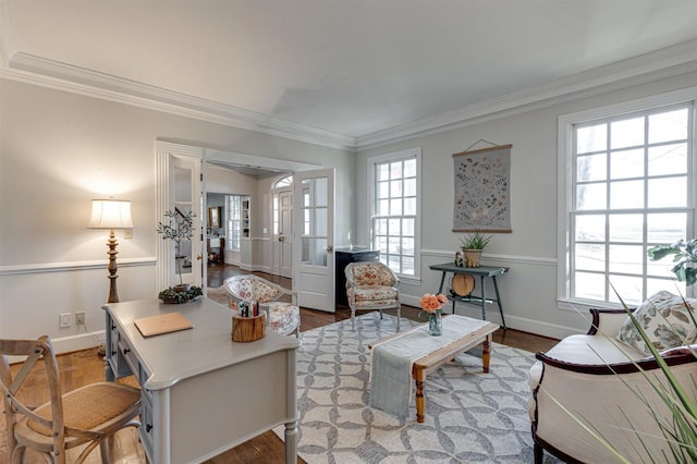 living room with ornamental molding and light hardwood / wood-style flooring