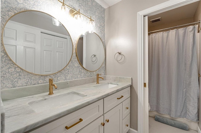 bathroom featuring vanity and a shower with curtain