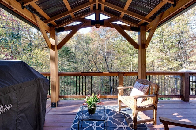 wooden deck featuring a gazebo and area for grilling